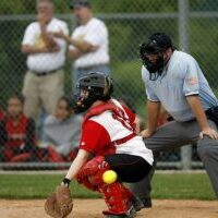 softball umpire and catcher